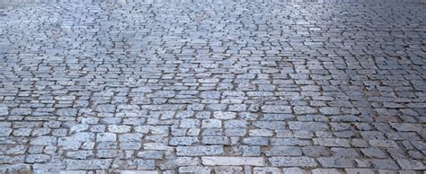 Stone paved footpath cobblestone pathway background texture | Premium Photo
