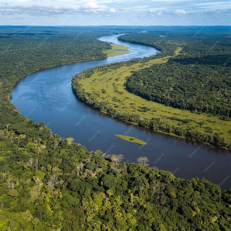 Aerial view of the Amazon River winding through the lush rainforest in Leticia Amazonas Colombia ...