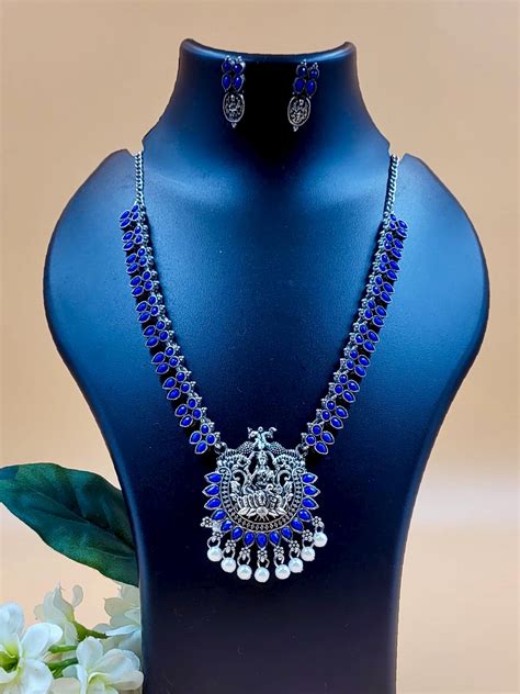 Godess Laxmi Embedded with Blue Artificial Stone with White Moti Laced ...