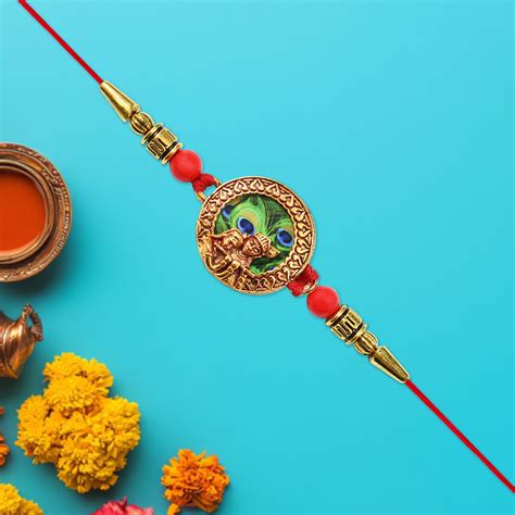 Traditional Radha Krishna Rakhi with Peacock Feather Design ...