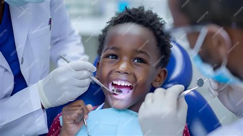 Smiling African American Boy Receiving Dental Checkup at Pediatric Clinic | Premium AI-generated ...
