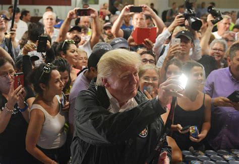 Donald Trump tosses rolls of paper towel to Puerto Rican residents like they are basketballs ...