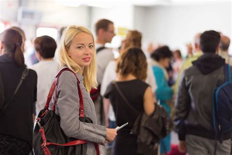 Young blond caucsian woman waiting in line. | CLV Resources Sdn Bhd