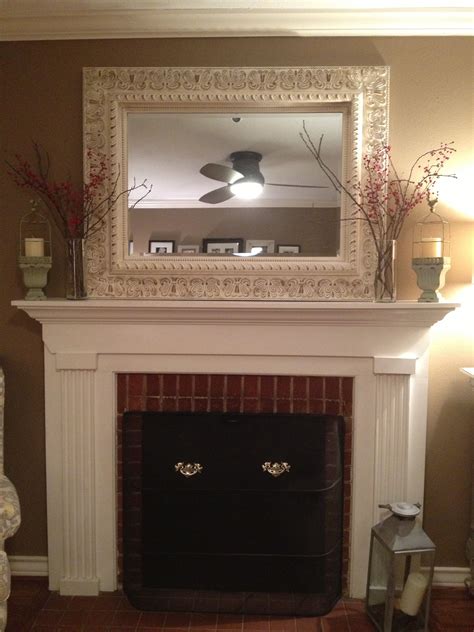 Distressed Mirror Over Fireplace