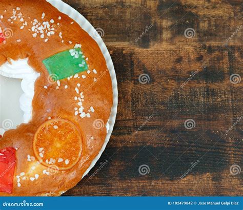 Spanish Christmas Cake with Fruits, Nut and Icing on Wooden Back Stock ...