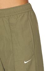 Nike Everythings Woven Mid Rise Open Hem Pant in Medium Olive & Sail ...
