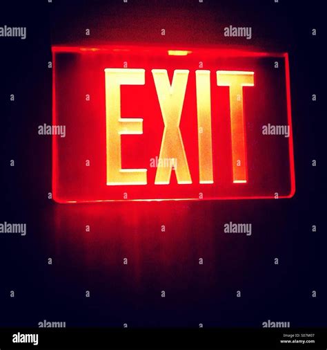 Red exit glowing sign Stock Photo - Alamy