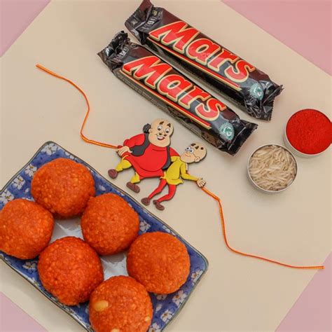 Send Motu Patlu Rakhi With Mars & Motichoor Laddoo Online