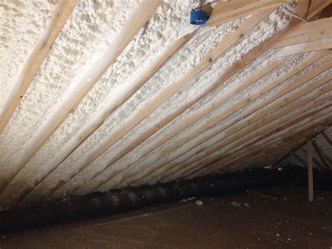 Open cell spray foam insulation installed in the roof deck of new house ...