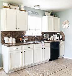 decorating ideas above kitchen cabinets 9 ways to decorate above your kitchen cabinets decorating ideas above kitchen cabinets 9 ways to decorate above your kitchen cabinets