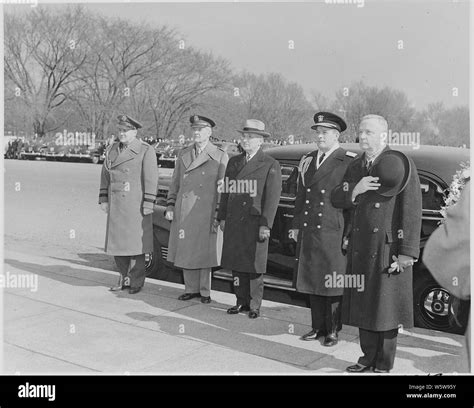 Photograph of President Truman standing beside his car with military ...