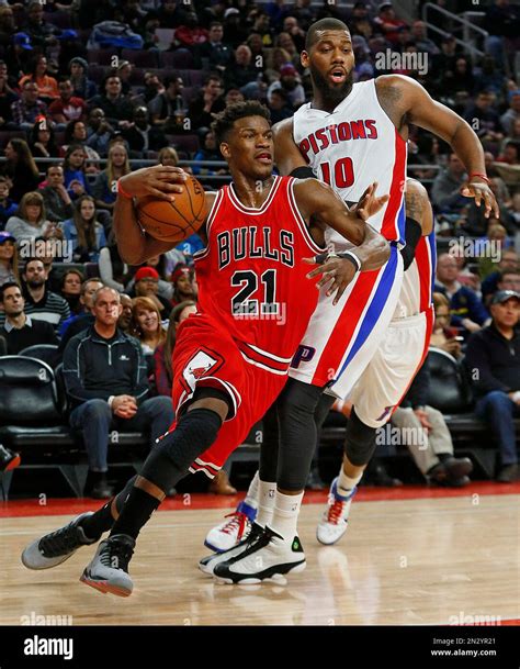 Chicago Bulls guard Jimmy Butler (21) drives on Detroit Pistons forward ...