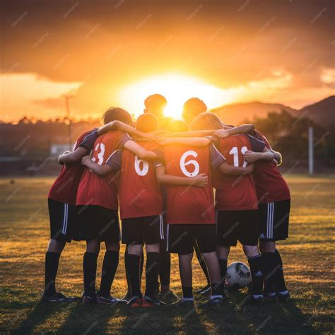 Premium Photo | A group of young soccer players huddled together in a ...