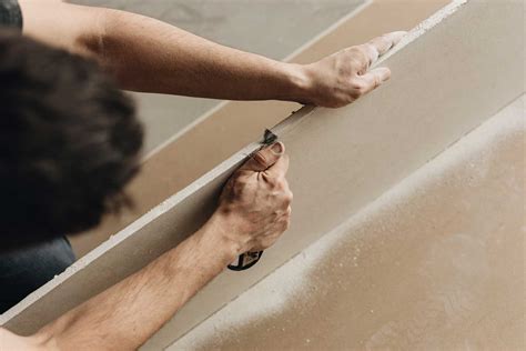Can Drywall Touch Concrete? Unveiling the Expert Answer