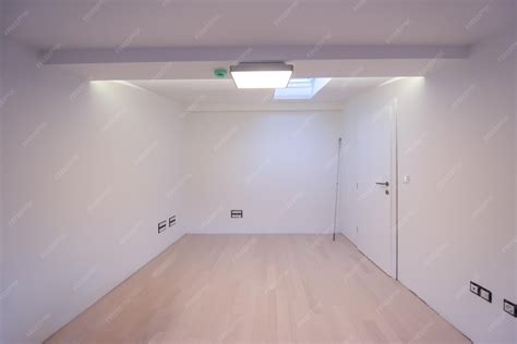 Premium Photo | Interior of empty room with hardwood floor,roof window ...