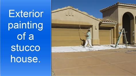 Spray painting exterior of a stucco house. - YouTube