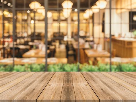 Wooden planks with blurred restaurant background | Free Photo