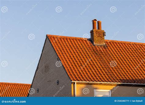 Terracotta Clay Roof Tiles on House with Golden Hour Light Stock Image ...