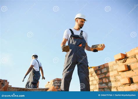 Professional Construction Workers Build a Brick House. Industrial Theme ...