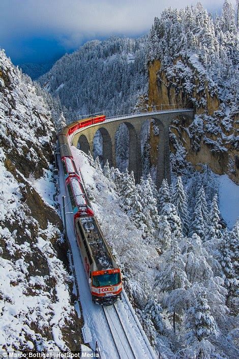 Stunning images show the highest railway service in Europe snaking through the Alps | Daily Mail Online