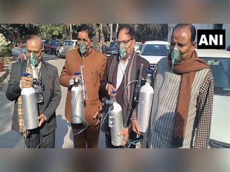 Delhi Assembly: BJP MLAs sport oxygen cylinders, gas masks