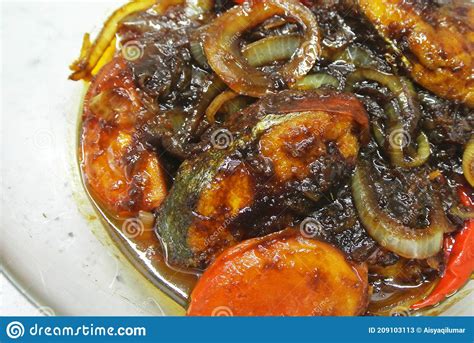Fried Spanish Mackerels Fish Cooked with Black Soy Sauce. Stock Image ...