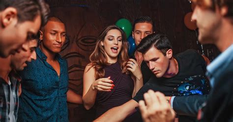 Kelly Brook gets ready to cut into a strange-looking cake at Mahiki ...