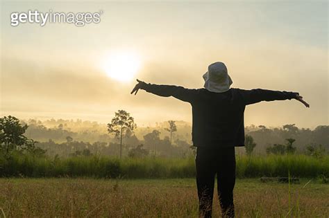 Traveler practicing healthy travel routines with morning stretching outdoors