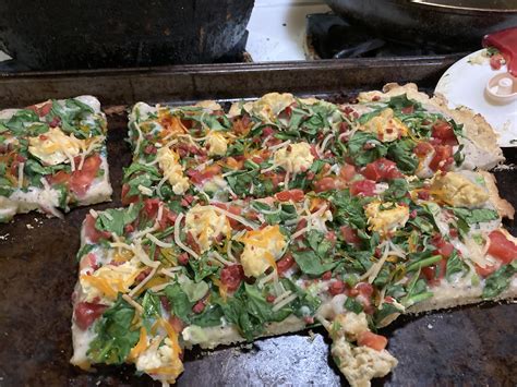 Homemade spinach, tomato, green onion pizza with homemade vegan Alfredo ...
