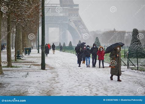 PARIS, FRANCE - JANUARY 16, 2021: People Passing by the Eiffel Tower in ...