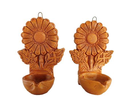 SHREE SAGAR EXPORTS - Pair of Flower Carved Wall Hanging Clay Diya ...
