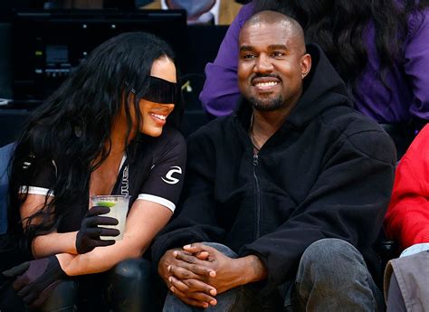 Kanye West salutes the crowd as he takes his Kim Kardashian clone ...