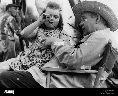 Sally Jane Bruce looks through director Charles Laughton's viewfinder ...