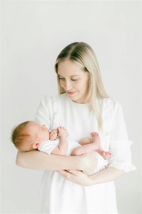 Smiling Mother Holding Baby · Free Stock Photo