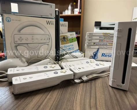 Wii Bundle (console case, steering wheels, controllers, and games) #2 ...