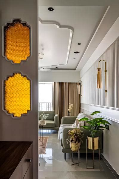 Elegant Hallway with Honeycomb Accent Mirrors and Soft Green Lounge Area