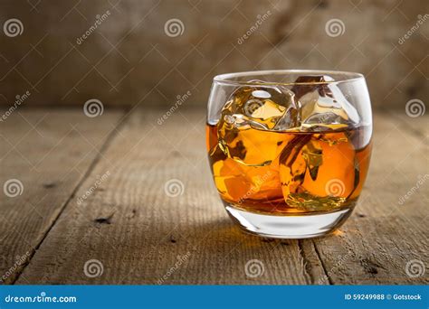 Glass of Scotch Whisky Brandy with Ice on Wooden Bar Table Rustic ...