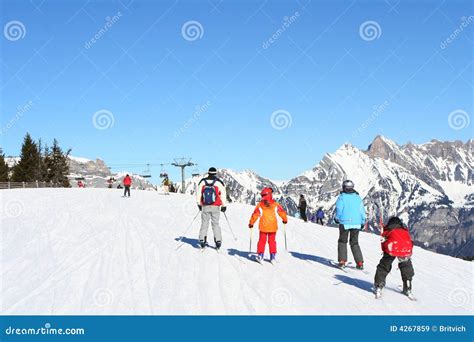 Families skiing in Alps stock image. Image of flums, christmas - 4267859