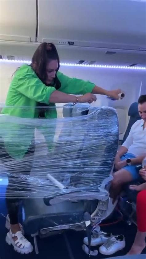crazy woman makes clingfilm fort on plane - One News Page VIDEO