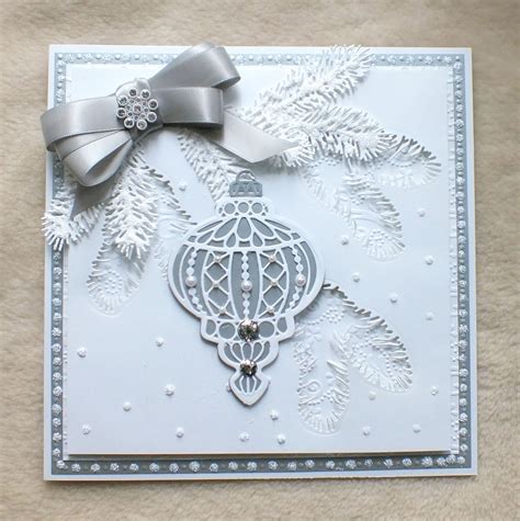 Luxury frosted pine, embellished silver bow, and die-cut Christmas ...