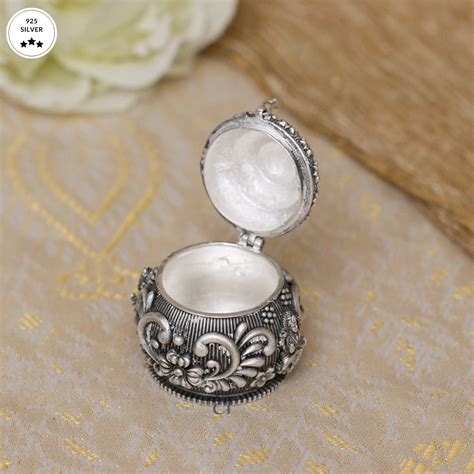 Buy Antique Silver Karanda with Lakshmi Motif From Aahi by Ranka Jewellers