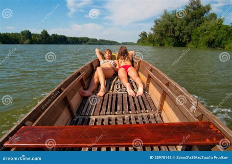 Cute Teenage Girls Sunbathing On The Boat Stock Photography | CartoonDealer.com #25952504