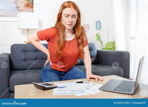 Woman Sitting on Couch and Suffers from Low Back Ache Stock Image ...