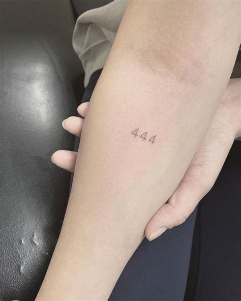 Tattoo of the number "444" located on the inner