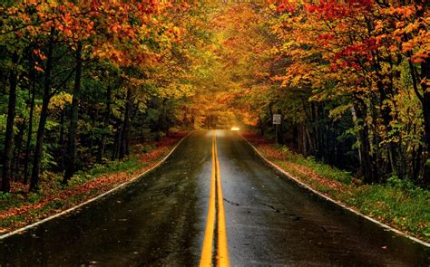 The fall foliage at Smugglers’ Notch State Park in Vermont, USA. Image by Naphat Photography ...