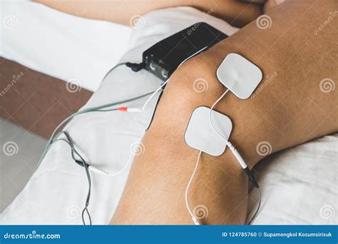 Patient Applying Electrical Stimulation Therapy on Knee Joint. T Stock Photo - Image of electric ...