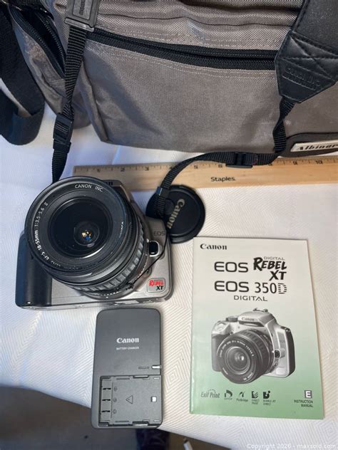 Canon EOS Rebel XT/350D DSLR, PowerShot camera, charger, manuals, lens ...