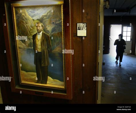 Theodore Judah stands in a portrait in the hallway at the school named ...