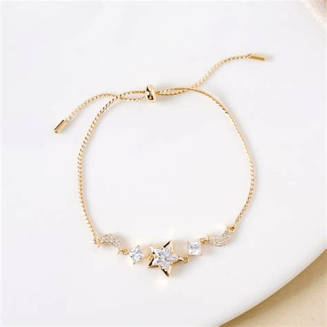 Jewellery Online - Premium Stars And Moon Gold Charm Bracelet | Nestasia