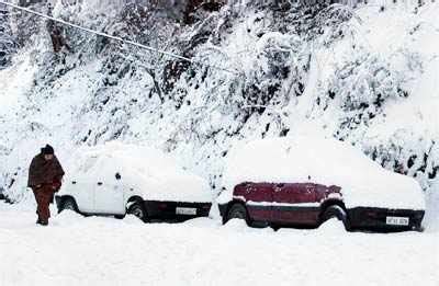 An aerial view of the snow capped city after a heavy snowfall, in ...